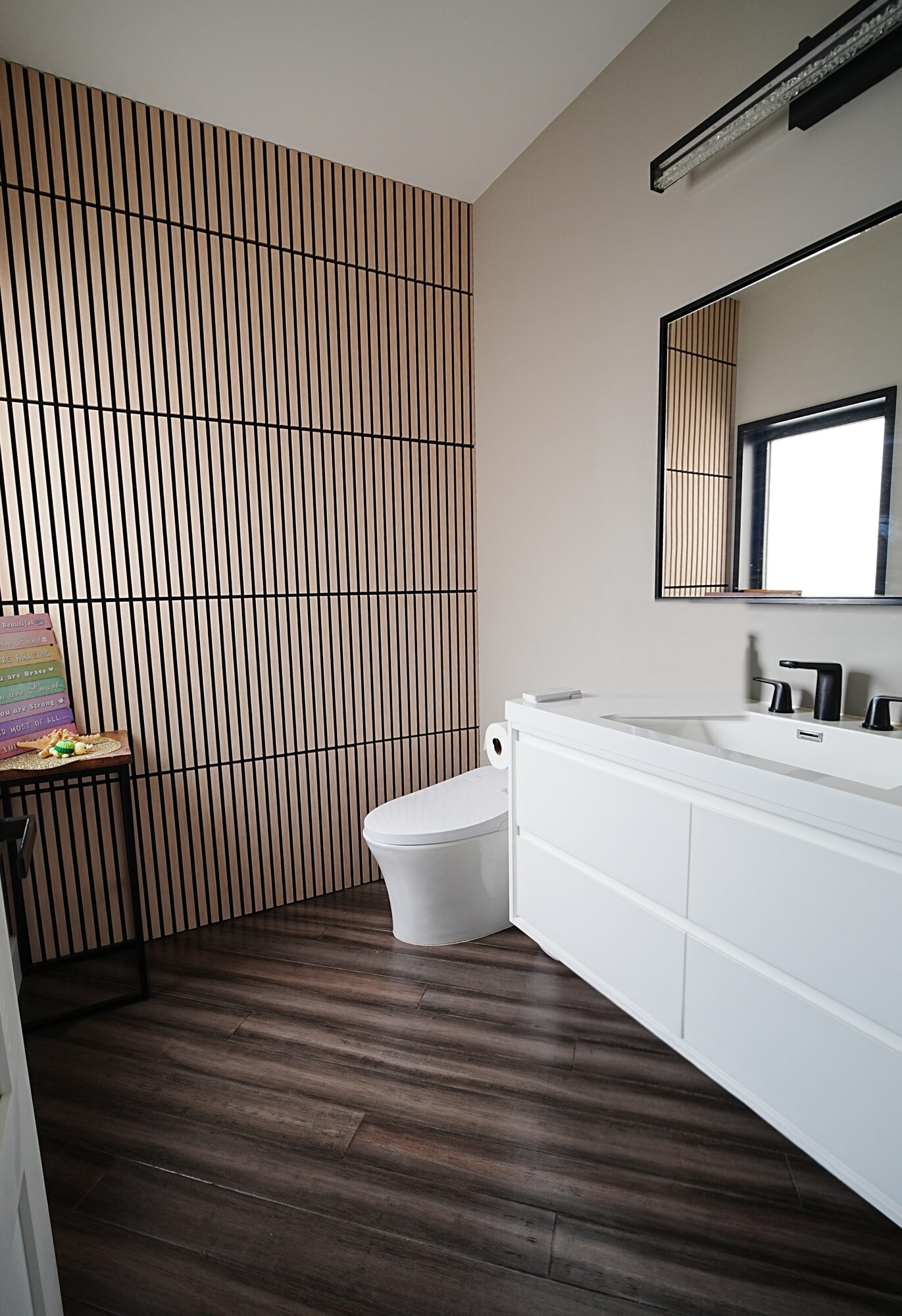 Bathroom with wood-slat accent wall