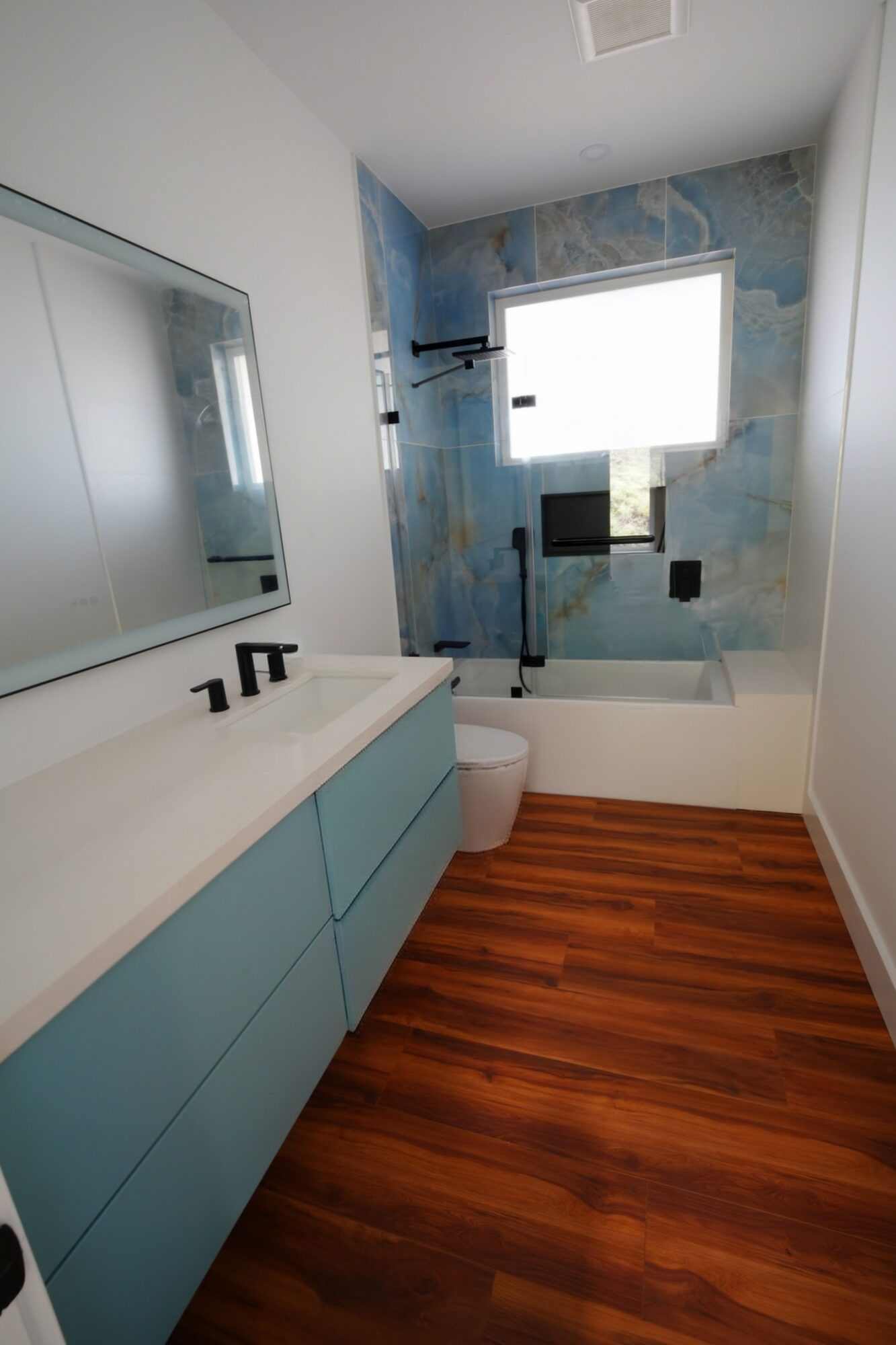 Bathroom with blue stone tile wall