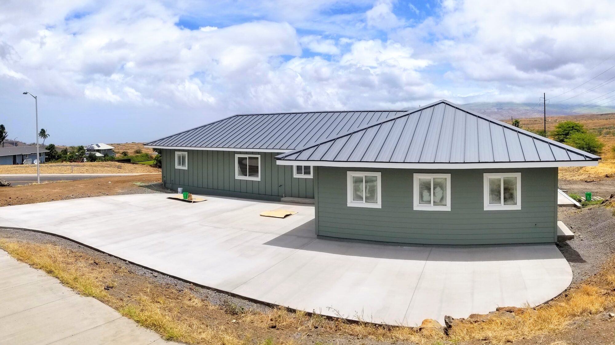 Finished home exterior with metal roof